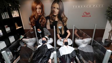 Louise Boothby (L) and Chloe Travis have their hair washed at a salon in Knutsford, Cheshire